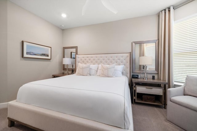 carpeted bedroom featuring ceiling fan