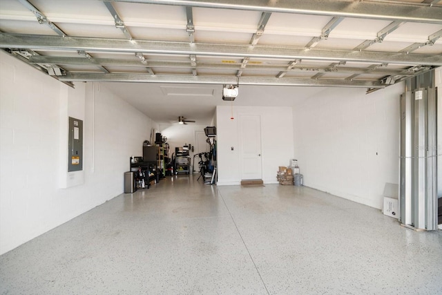 garage featuring a garage door opener and electric panel