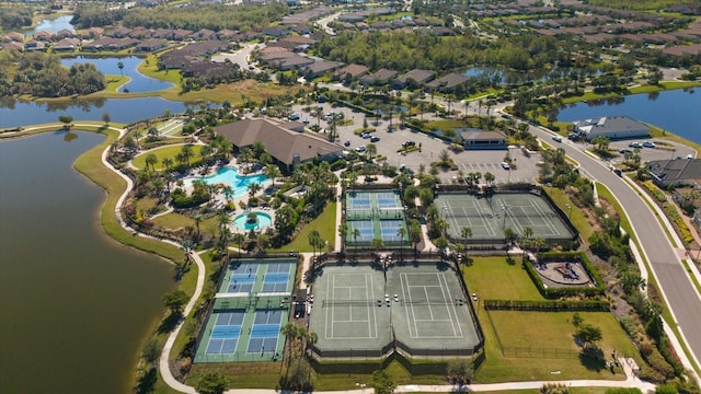 birds eye view of property with a water view