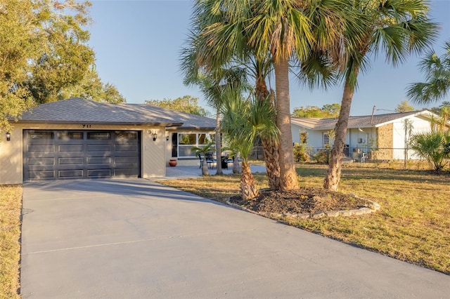 single story home with a garage