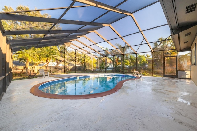 view of pool with a lanai and a patio