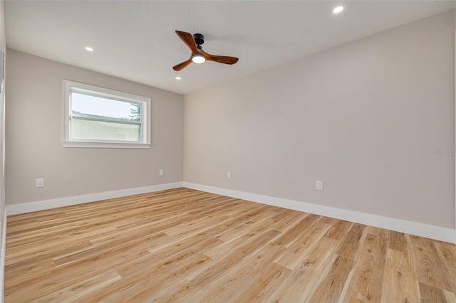 unfurnished room with ceiling fan and light hardwood / wood-style flooring