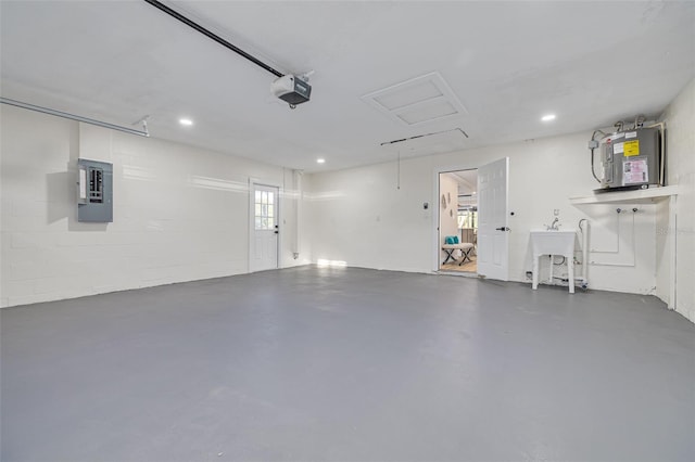 garage with water heater, a garage door opener, and electric panel