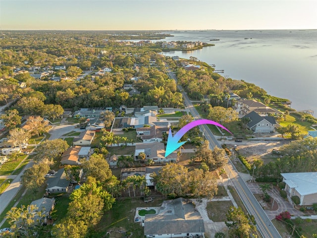 aerial view at dusk with a water view