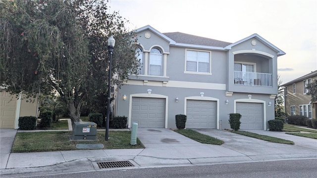 view of front of house featuring a balcony and a garage