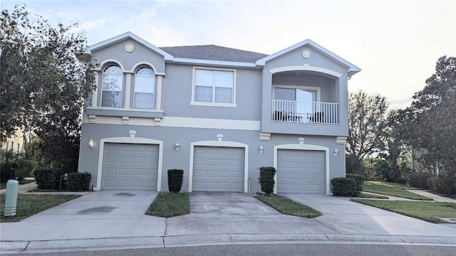 9060 Moonlit Meadows Loop, Riverview, FL 33578 - townhome / multi-family property with concrete driveway, a garage, and stucco siding