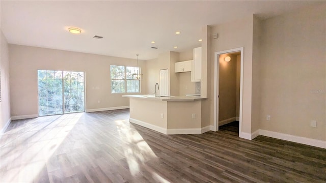 9060 Moonlit Meadows Loop, Riverview, FL 33578 - kitchen with a sink, white cabinets, dark wood finished floors, baseboards, and recessed lighting