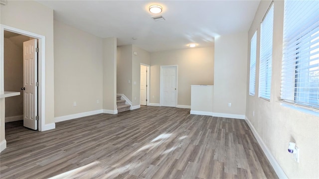 9060 Moonlit Meadows Loop, Riverview, FL 33578 - unfurnished room with wood finished floors, baseboards, and stairway