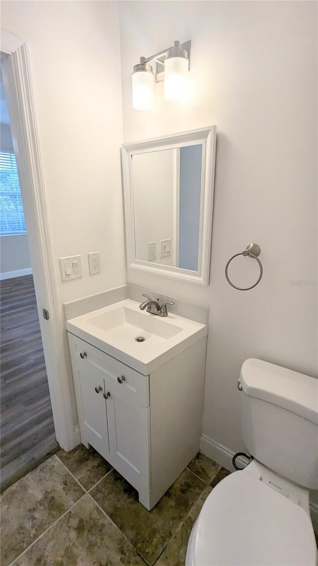9060 Moonlit Meadows Loop, Riverview, FL 33578 - bathroom with vanity, baseboards, toilet, and tile patterned flooring