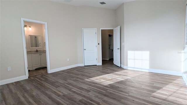 9060 Moonlit Meadows Loop, Riverview, FL 33578 - unfurnished bedroom with dark wood-type flooring, baseboards, a sink, and ensuite bathroom