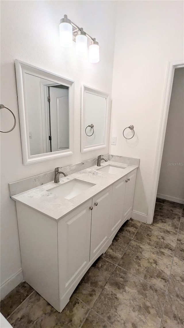9060 Moonlit Meadows Loop, Riverview, FL 33578 - bathroom with double vanity and baseboards