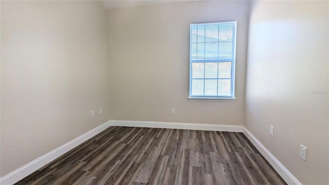 9060 Moonlit Meadows Loop, Riverview, FL 33578 - empty room featuring dark wood-type flooring and baseboards