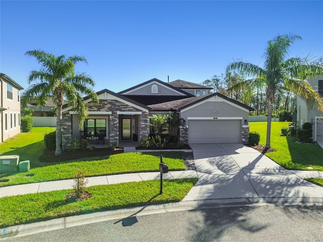 craftsman house with a garage and a front yard