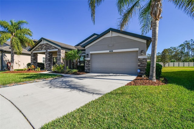 8144 Sequester Loop, Land O Lakes, FL 34637 - view of front of home featuring stone siding, a garage, concrete driveway, and stucco siding