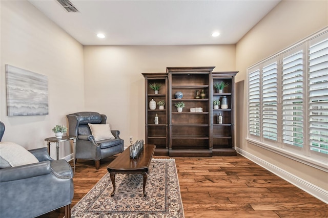 living area with dark hardwood / wood-style floors