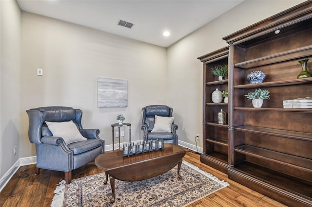 living area with dark hardwood / wood-style flooring