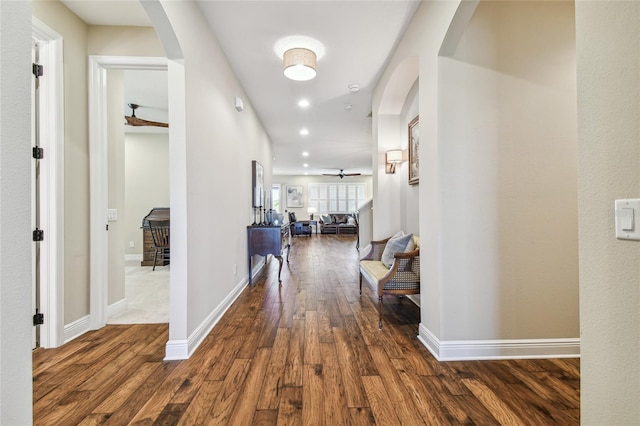 hall with dark hardwood / wood-style floors