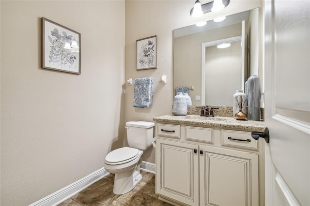 8144 Sequester Loop, Land O Lakes, FL 34637 - half bath featuring toilet, vanity, tile patterned floors, and baseboards