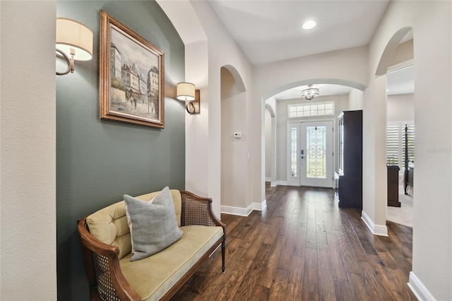 8144 Sequester Loop, Land O Lakes, FL 34637 - foyer entrance with arched walkways, dark wood-style flooring, baseboards, and recessed lighting
