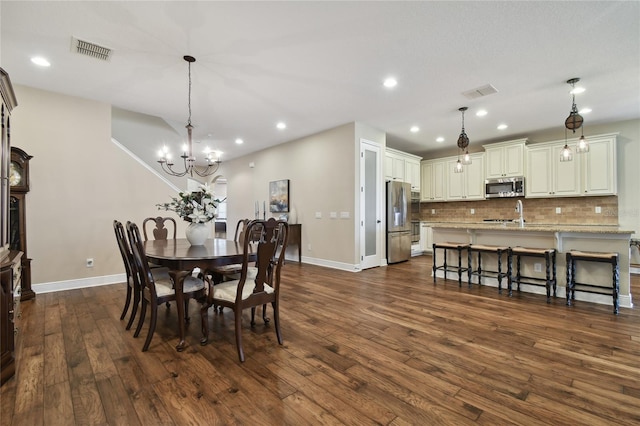 8144 Sequester Loop, Land O Lakes, FL 34637 - dining area with baseboards, a chandelier, dark wood finished floors, and recessed lighting