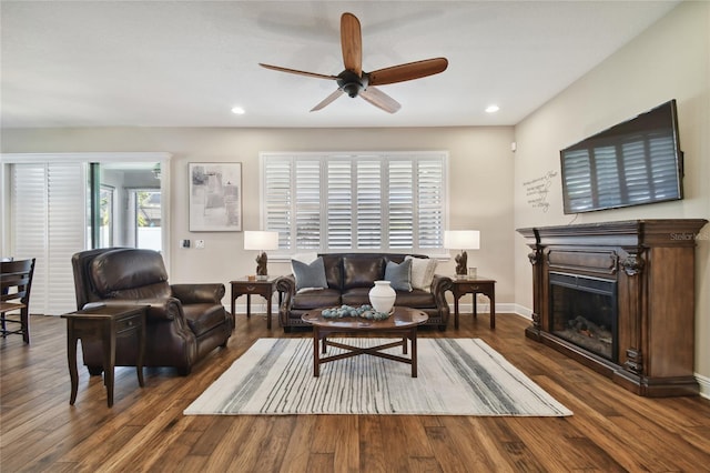 8144 Sequester Loop, Land O Lakes, FL 34637 - living room with ceiling fan, recessed lighting, wood finished floors, a glass covered fireplace, and baseboards