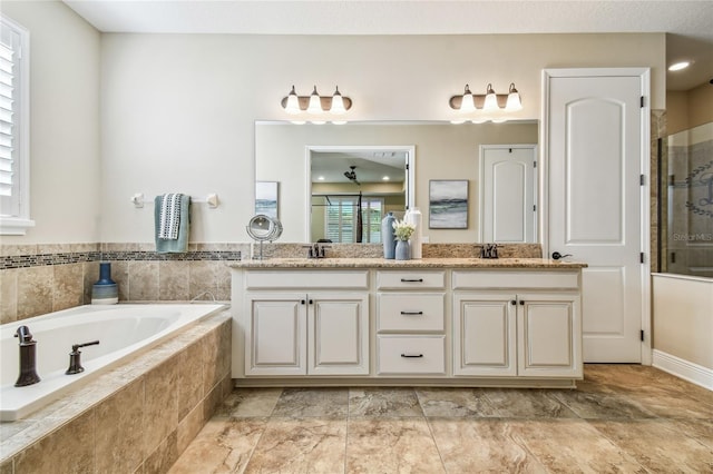 bathroom with vanity and plus walk in shower