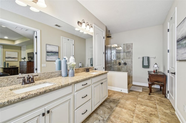 8144 Sequester Loop, Land O Lakes, FL 34637 - bathroom featuring a walk in shower, double vanity, and baseboards