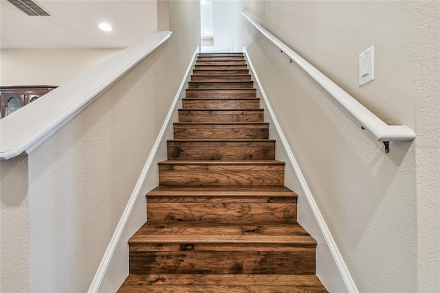 stairway featuring hardwood / wood-style flooring