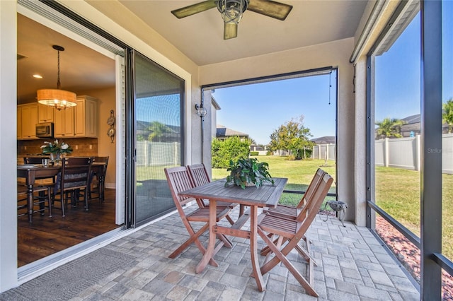 8144 Sequester Loop, Land O Lakes, FL 34637 - sunroom with ceiling fan and a chandelier