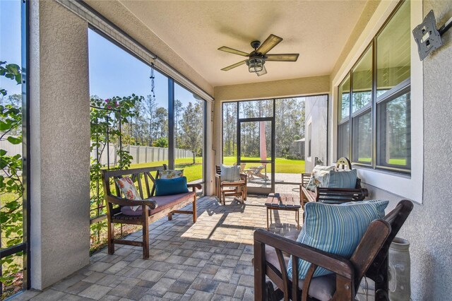 sunroom / solarium with ceiling fan