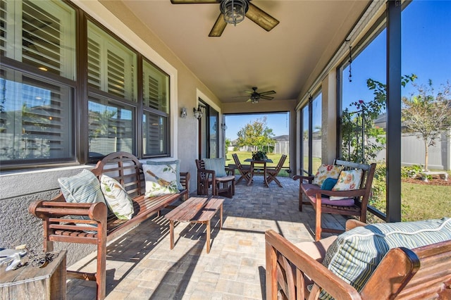 sunroom / solarium with ceiling fan