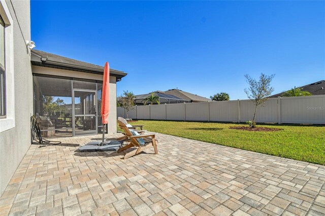 view of patio with a sunroom