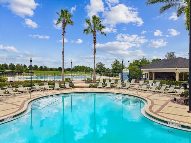 view of swimming pool with a patio