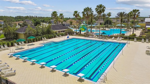 view of swimming pool featuring a patio area