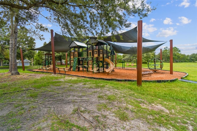 view of playground with a lawn