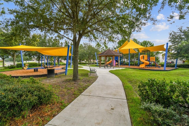 view of jungle gym featuring a lawn