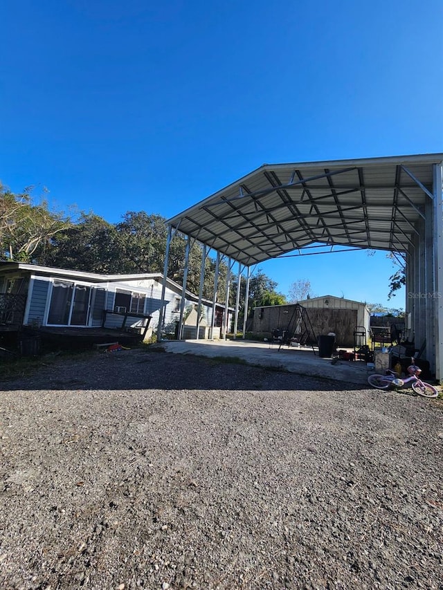 view of parking featuring a carport