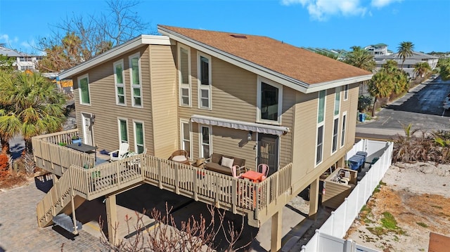 rear view of property with a deck