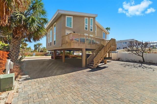 back of property featuring a carport