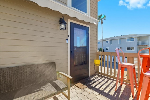 view of exterior entry with covered porch