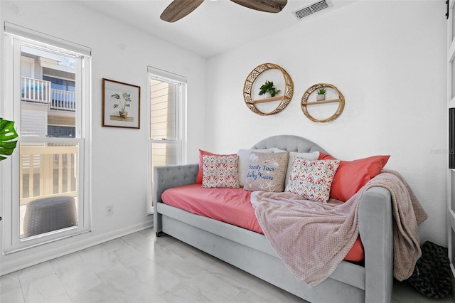 interior space featuring ceiling fan