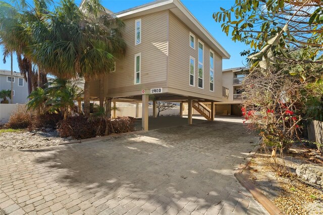 view of side of home with a carport