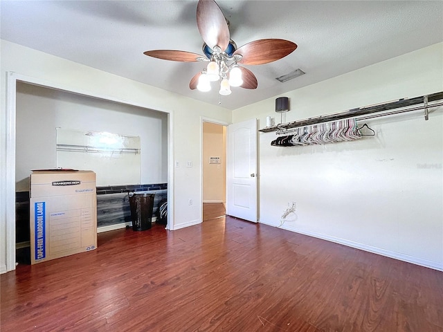 interior space featuring dark hardwood / wood-style floors and ceiling fan