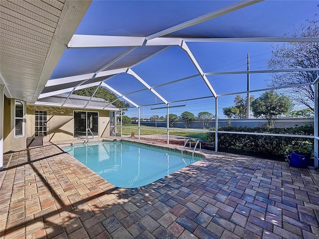 view of pool featuring a lanai and a patio area