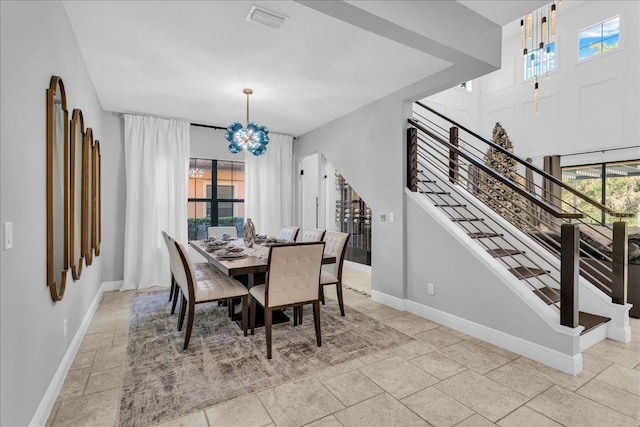 dining area with a notable chandelier and a wealth of natural light