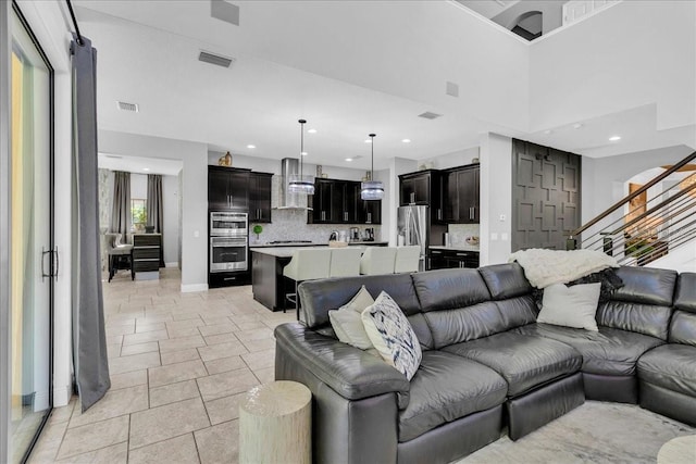 living room with a towering ceiling