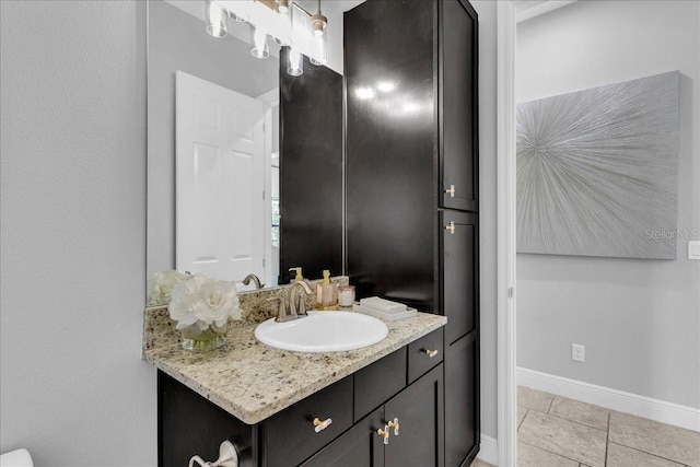 bathroom with tile patterned flooring and vanity