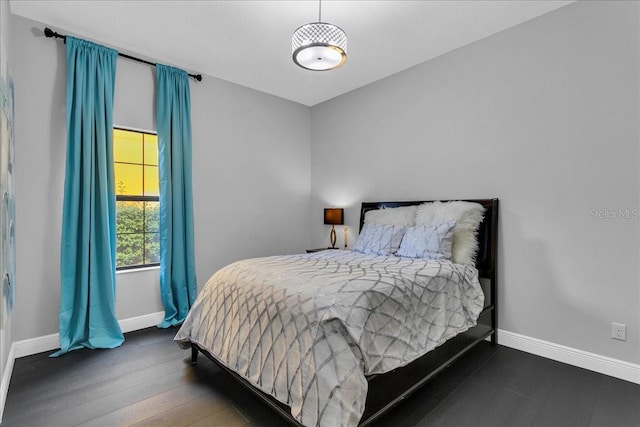 bedroom featuring dark hardwood / wood-style flooring