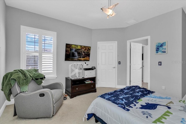 bedroom featuring light colored carpet