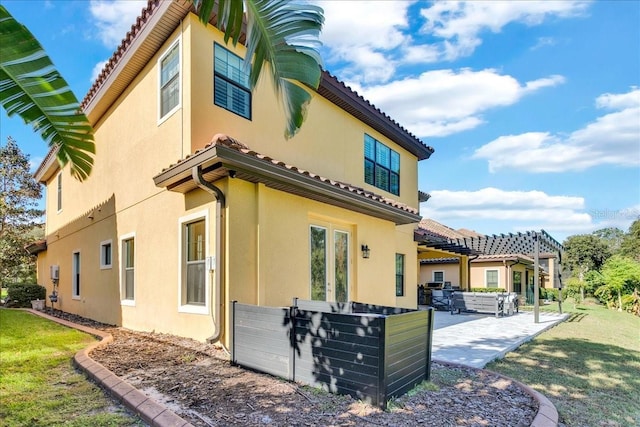 rear view of property featuring a patio